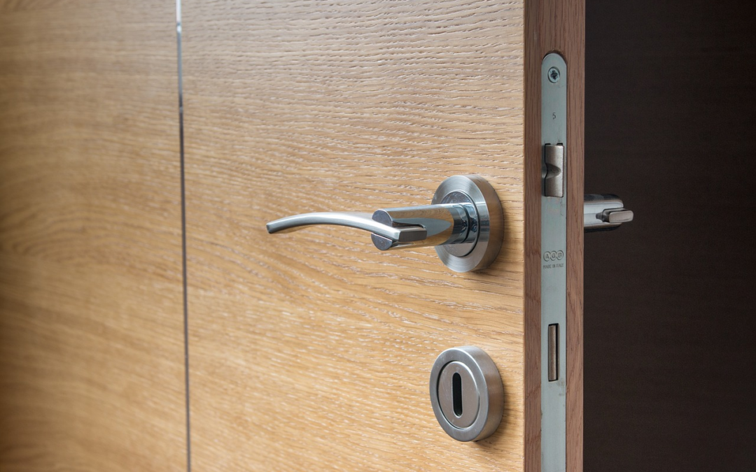 A Wooden Door with a Handle, Keyhole, and an Electric Strike Door Locks